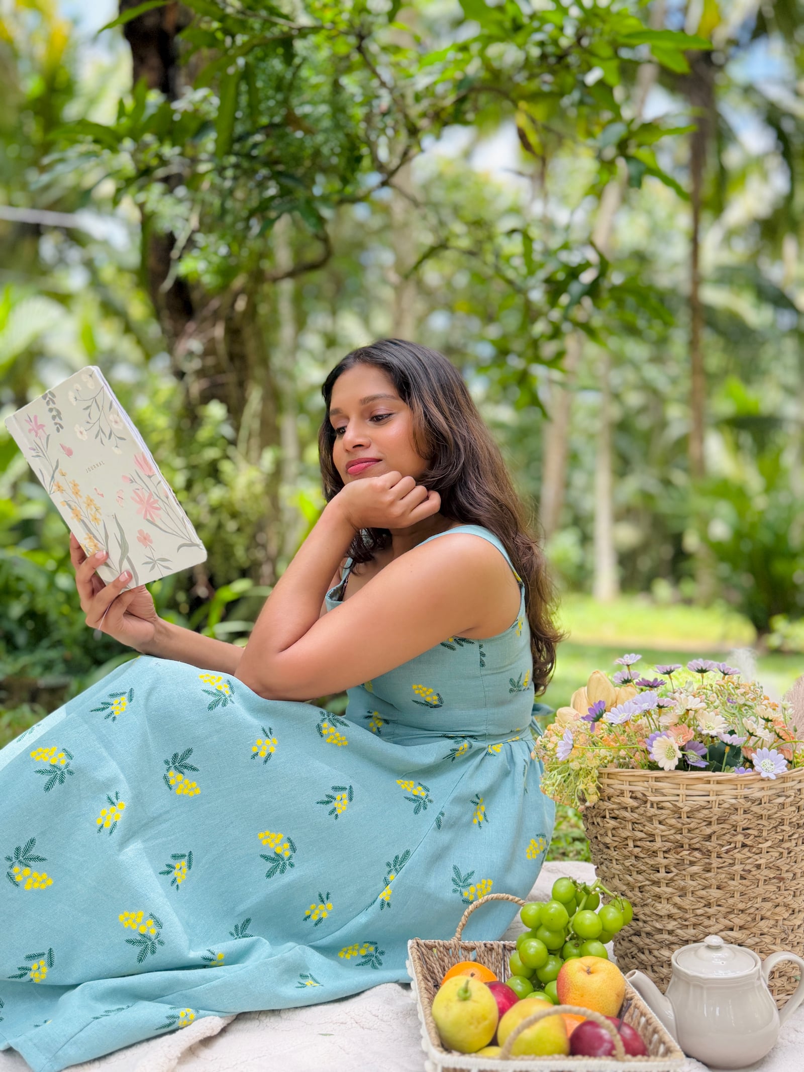 Ayléa Boutique teal floral dress in a tropical garden
